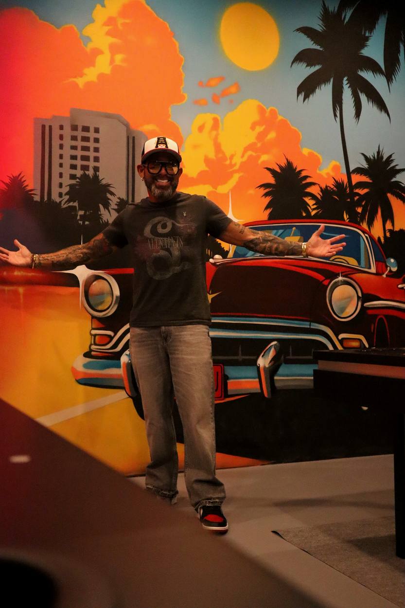 David Sugarman in front of a Miami mural